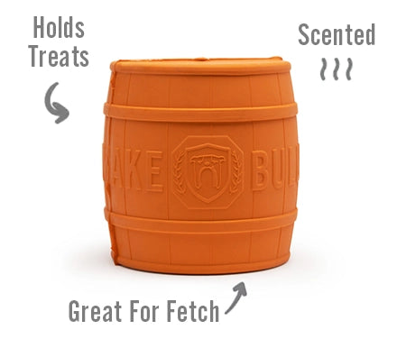 Orange barrel-shaped dog toy with text indicating features on a white background